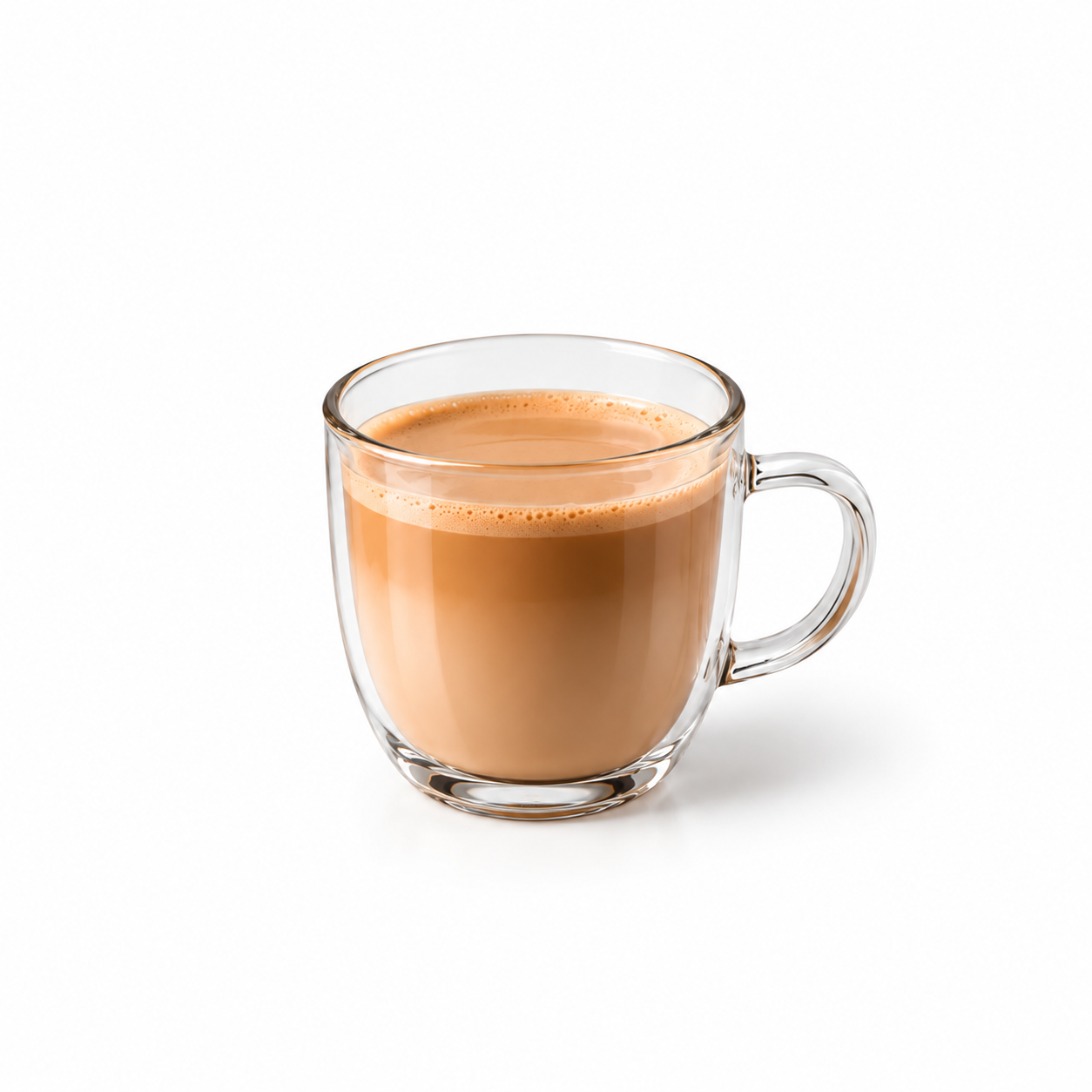 Masala chai latte in a clear glass mug